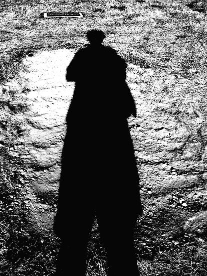 shadow on a new grave