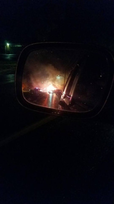 Rear-View mirror view of Car Fire